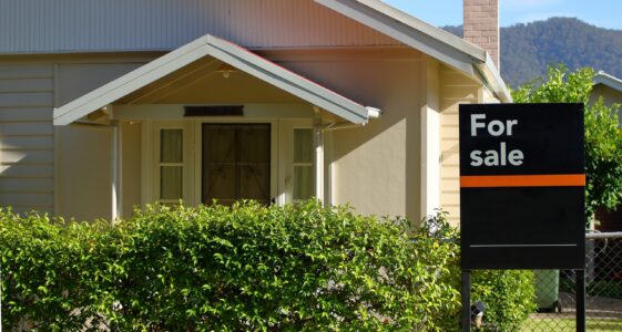 House with Sale Sign