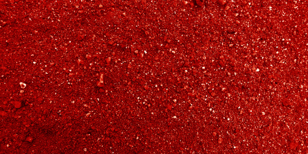 close up of iron-rich red soil