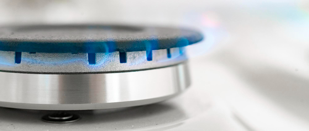 Close up of gas burning out of a stove element