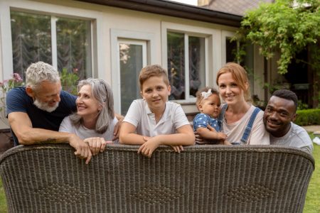 Family of different generations smiling at the camera